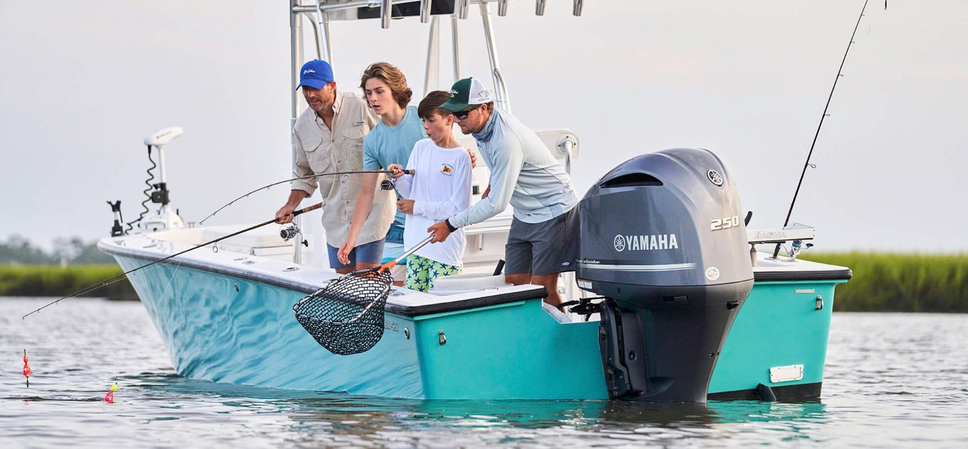 Men and boys fishing on boat