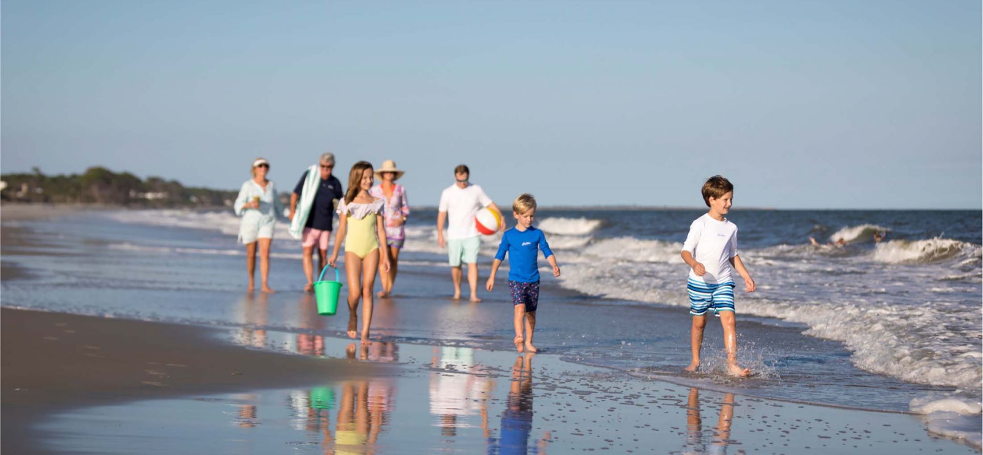 Family walking along beach