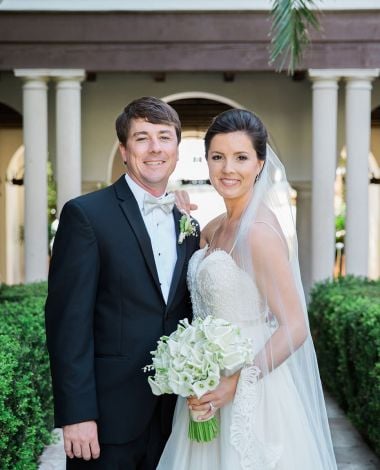 bride and groom posing