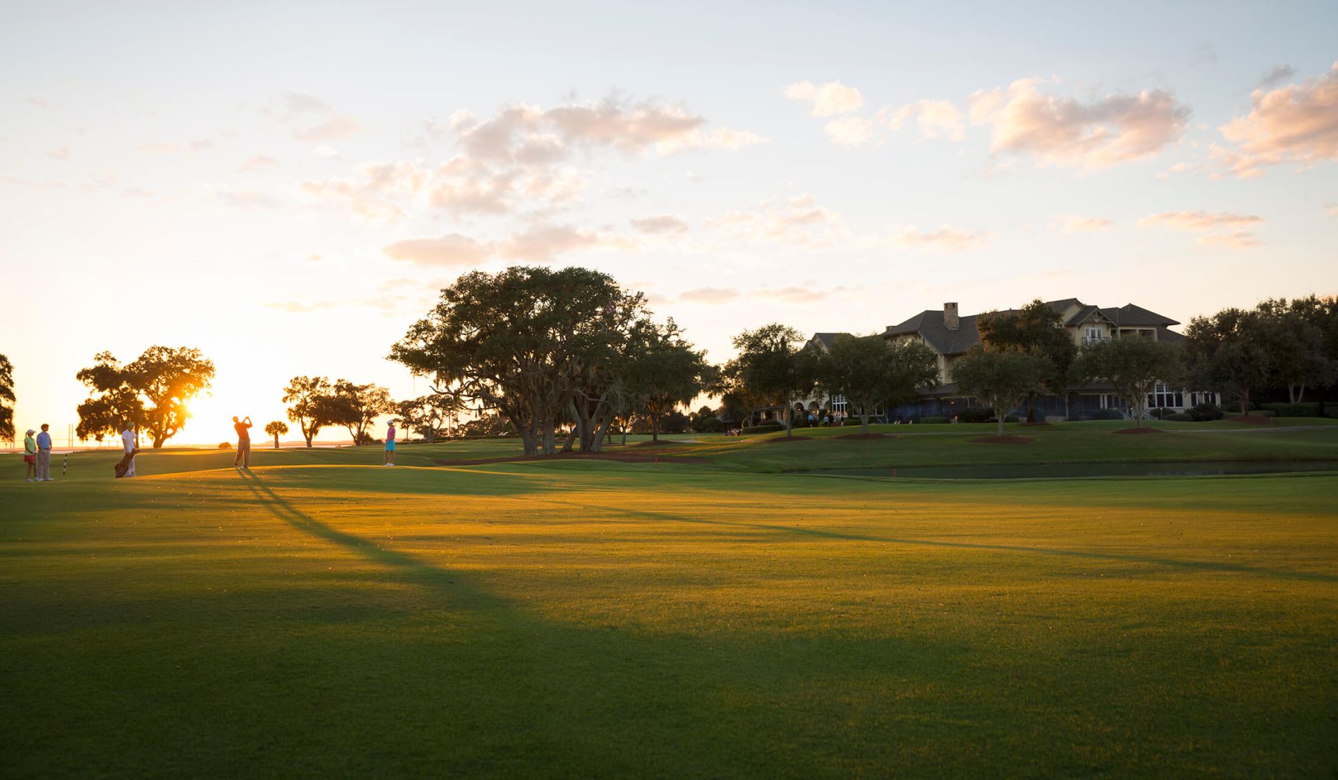 a golfer playing a round on the plantation golf course by the lodge at sea island