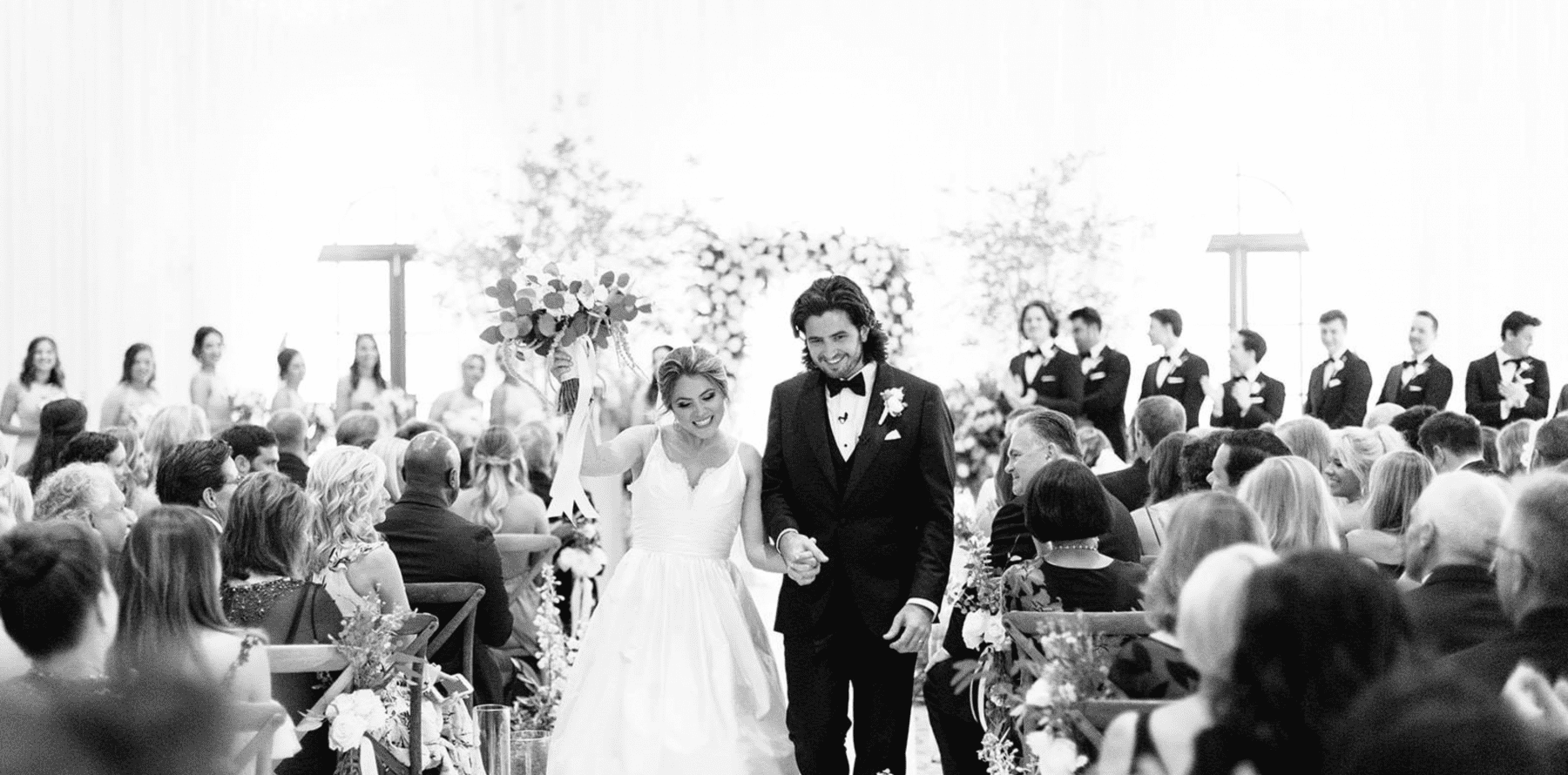 bride and groom walking down the aisle after getting married