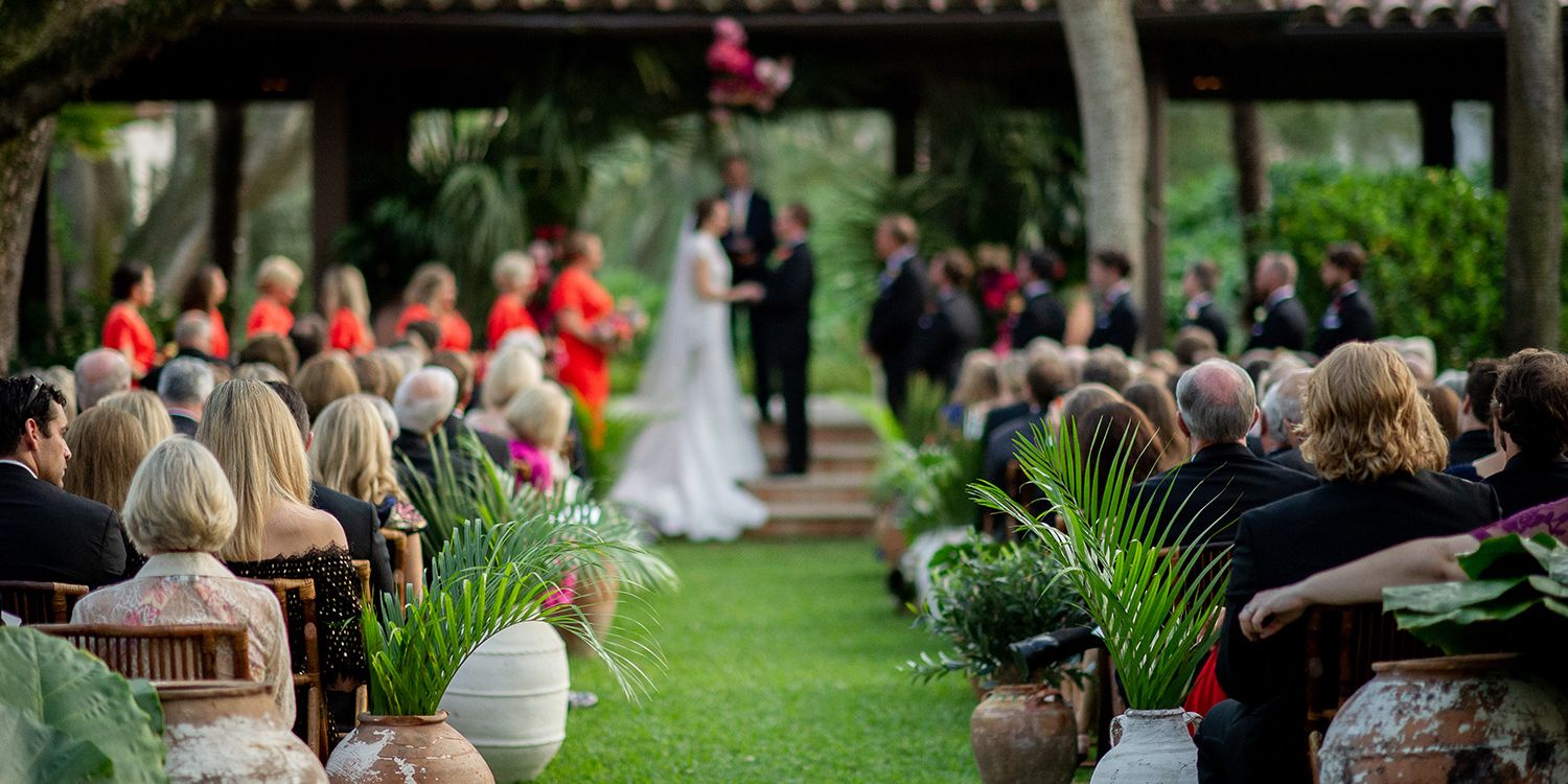 people watching the bride and groom get married