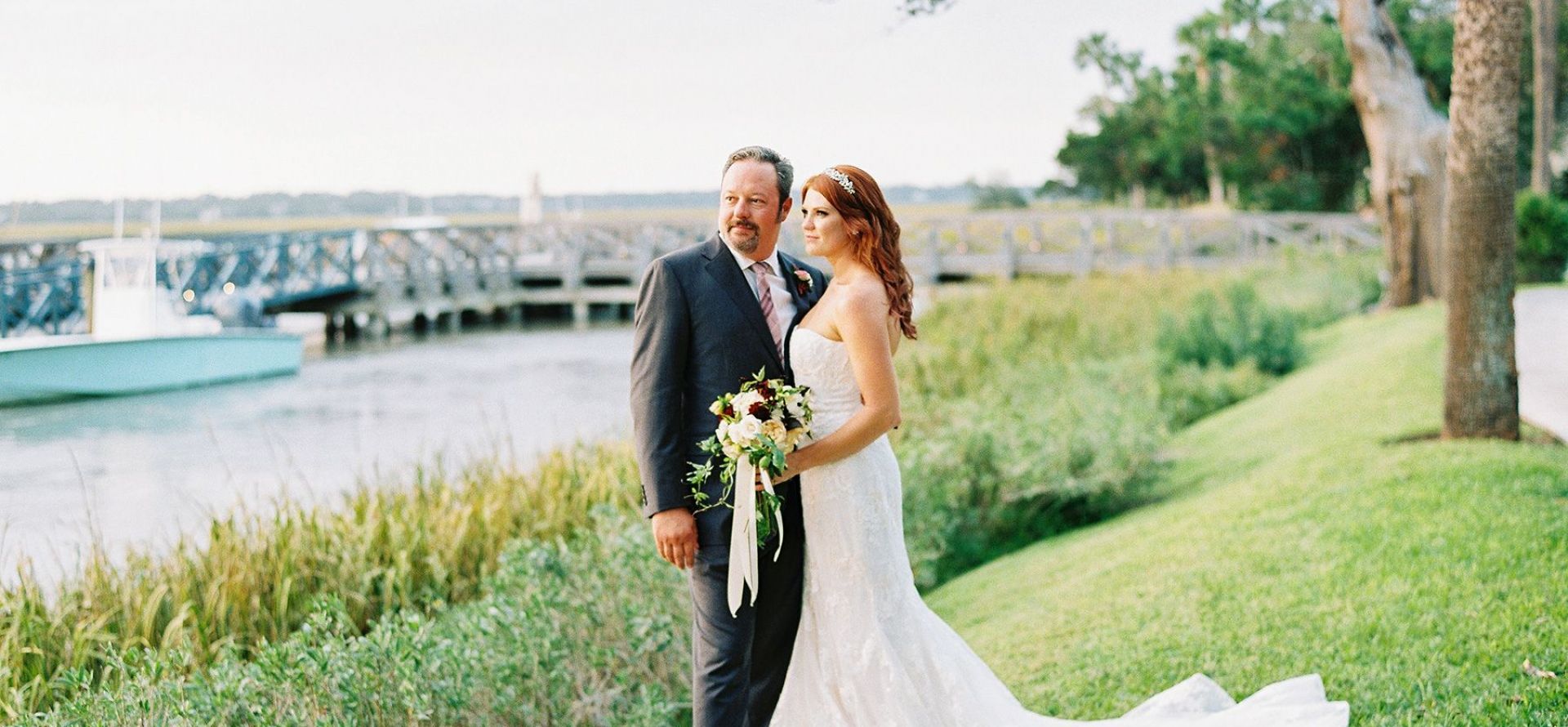 a bride and groom pose for a photo