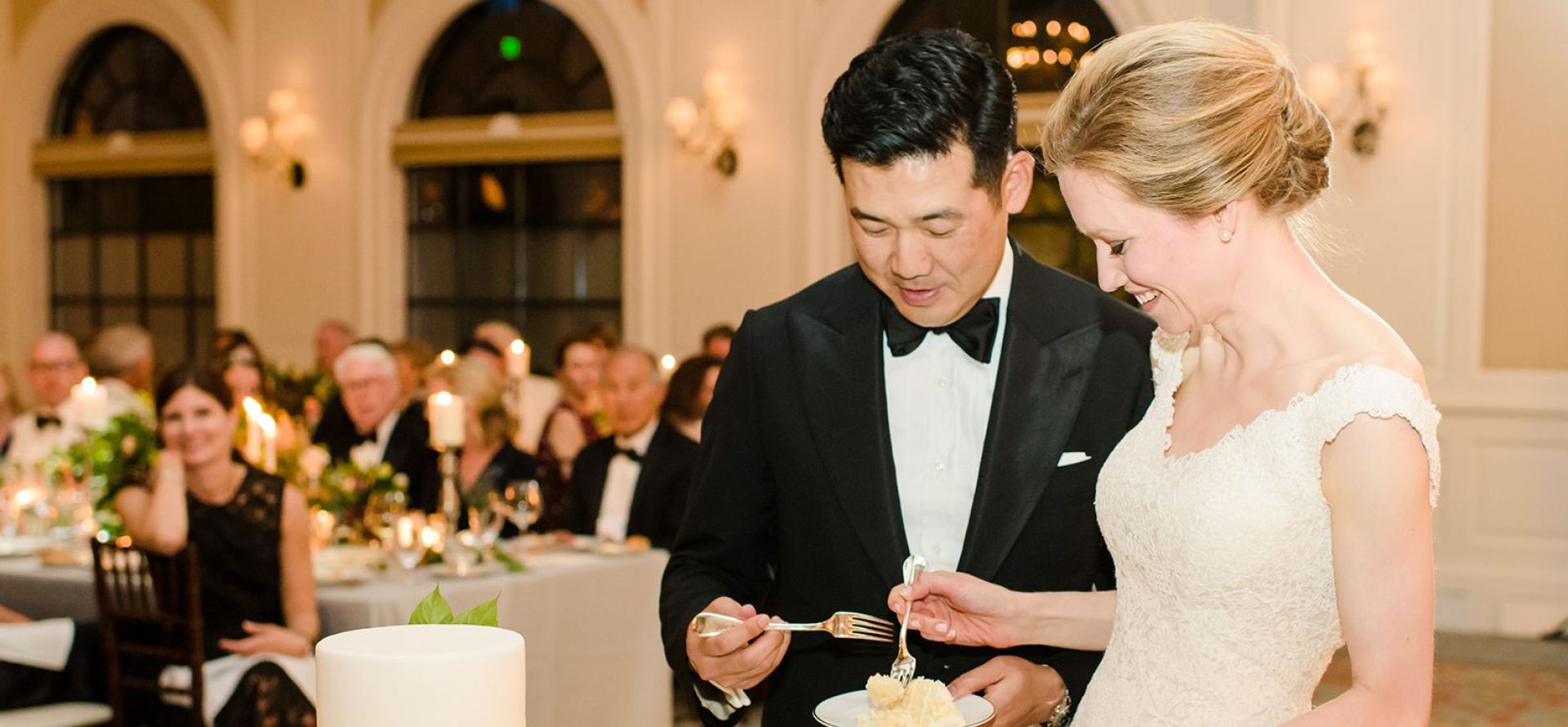 bride and groom eating cake