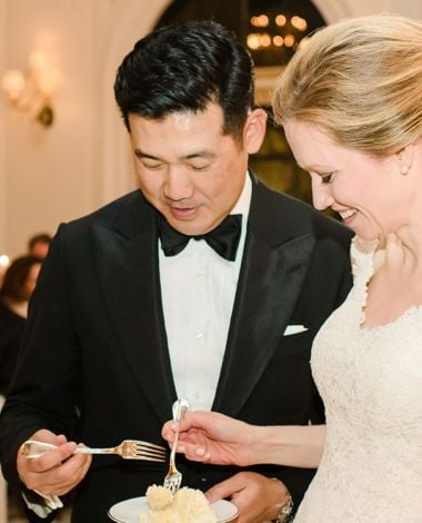 bride and groom eating cake