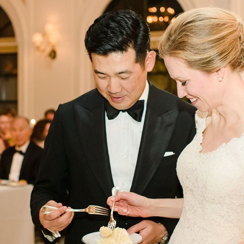 bride and groom eating cake