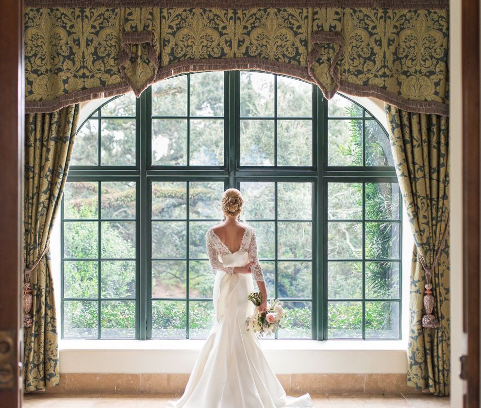 bride looking out large window