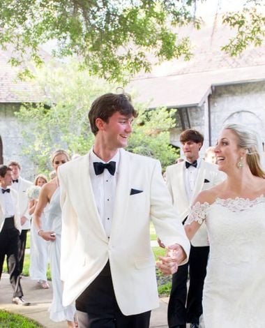 husband and wife walking away from ceremony