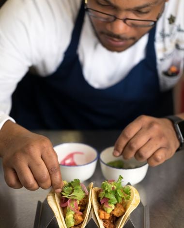 chef michael mckenzie preparing food at southern tide