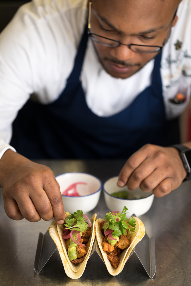 chef michael mckenzie preparing food at southern tide