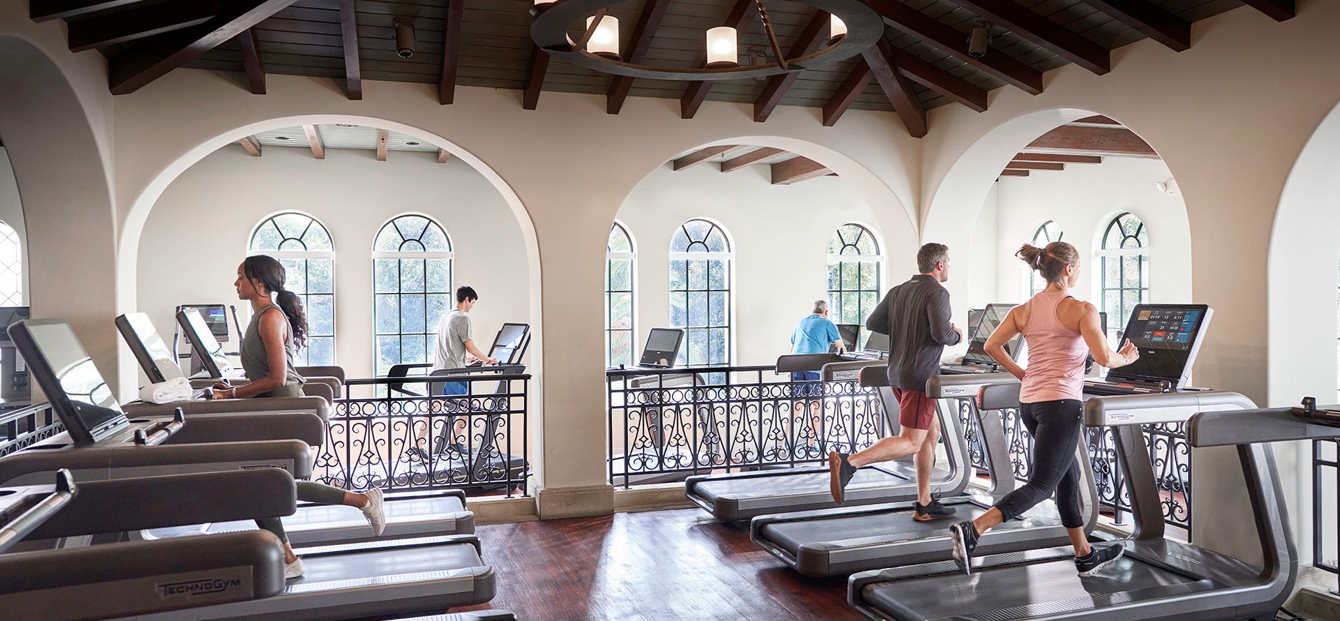 a group of people running on treadmills at the sea island spa and fitness center