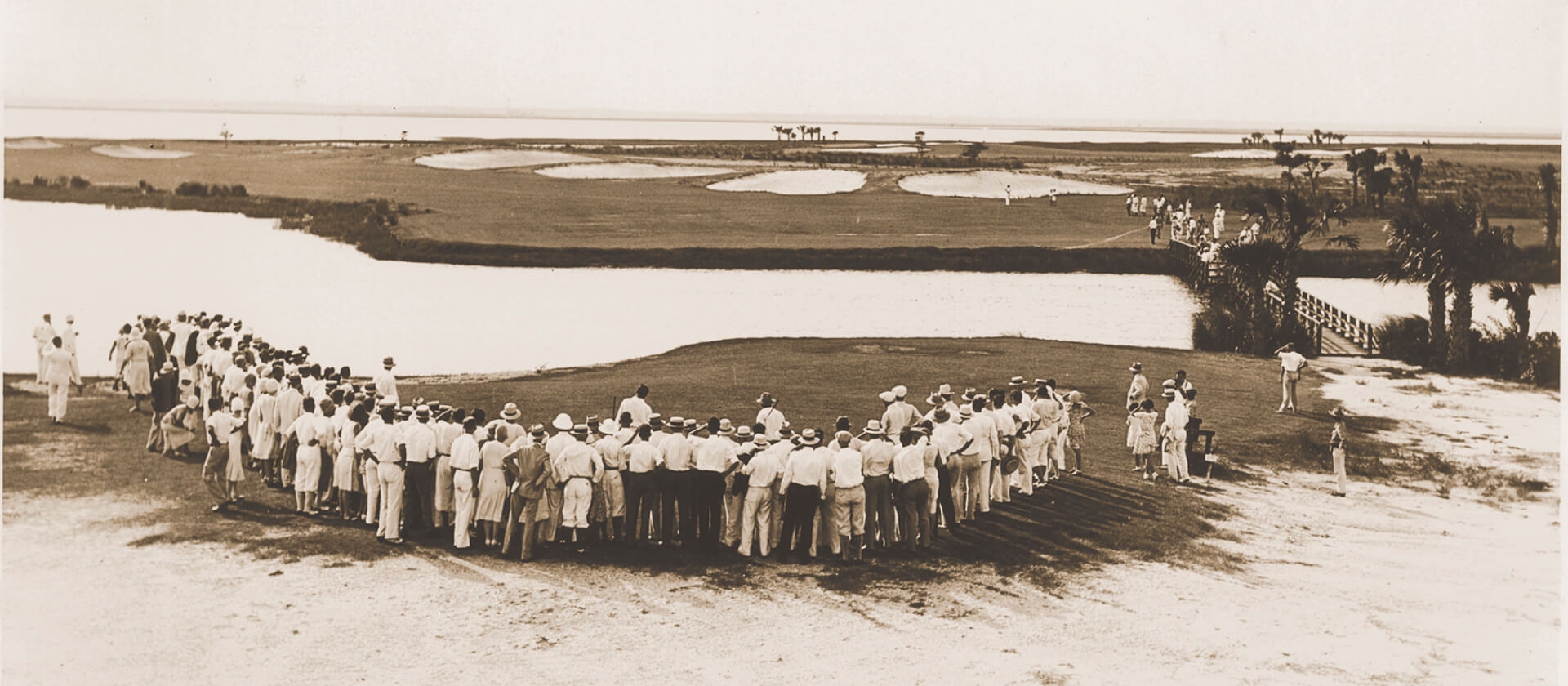 Sepia tone photo from the early 20th century of a golf game at Sea Island