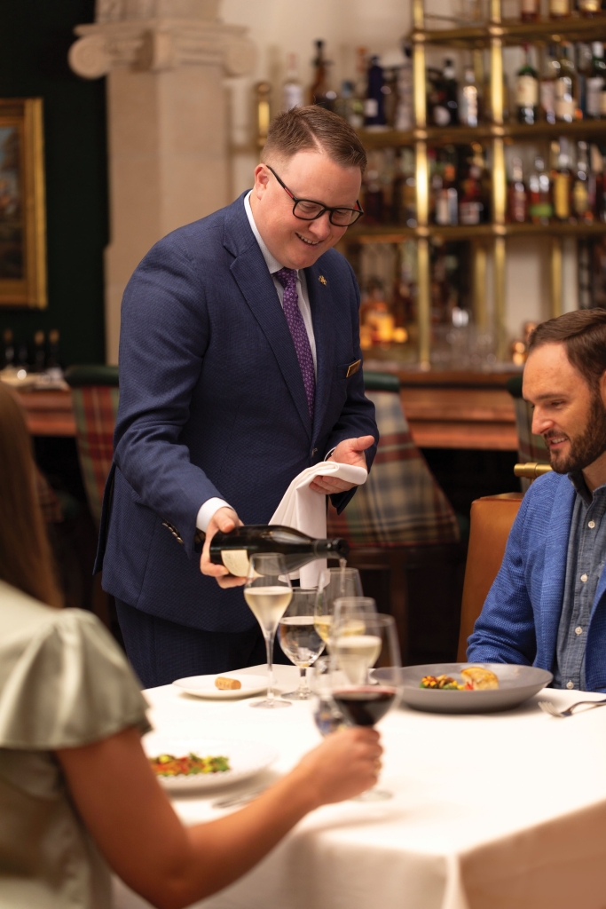 sommelier pouring wine