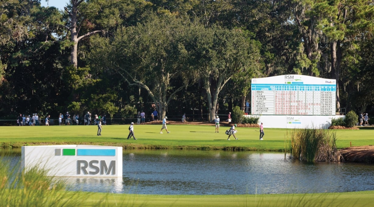 Davis Love III playing at The RSM Classic, players and spectators walking to next hole