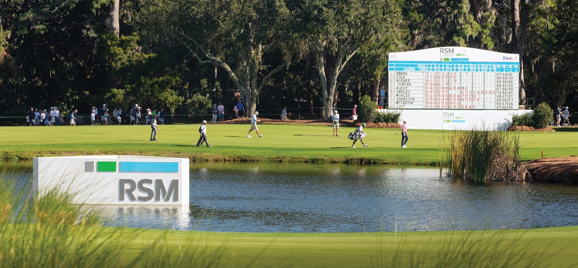 Davis Love III playing at The RSM Classic, players and spectators walking to next hole