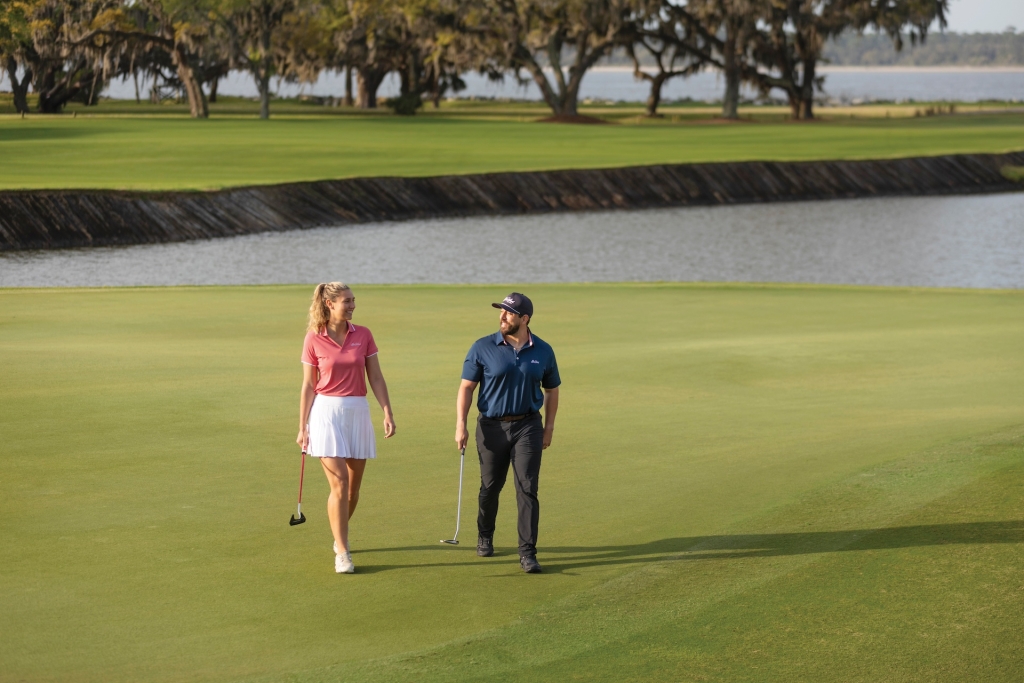 A couple enjoying a round of golf