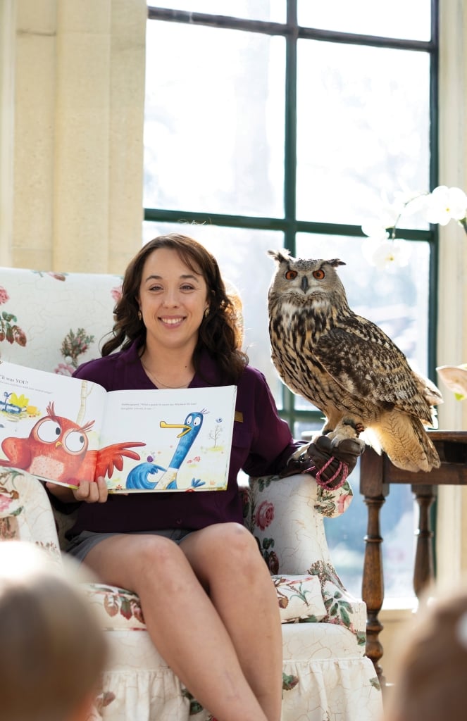 Children enjoying Storytime with Scout, the Eurasian Eagle Owl.