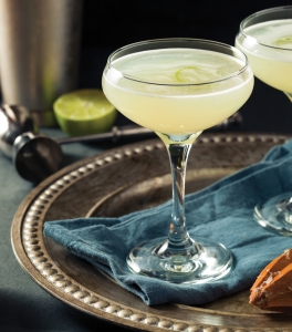 Bright green Vesper Martinis on a brass tray