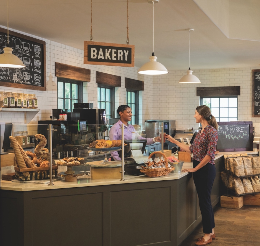 A customer buys bread from a bakery
