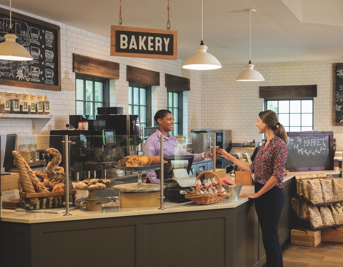 A customer buys bread from a bakery