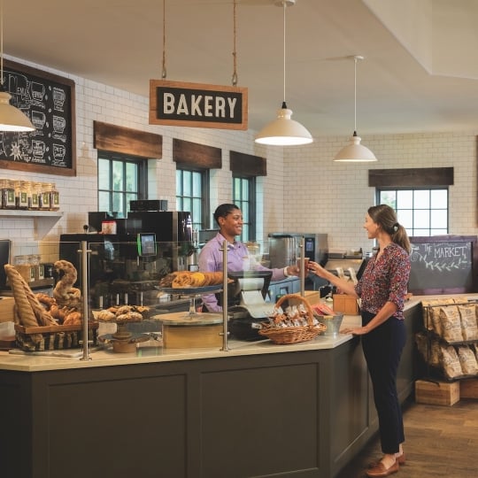 A customer buys bread from a bakery