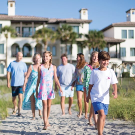 Guests walking to Sea Island Beach.