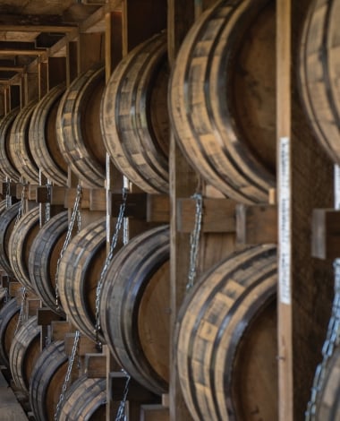 A row of barrels in a rickhouse