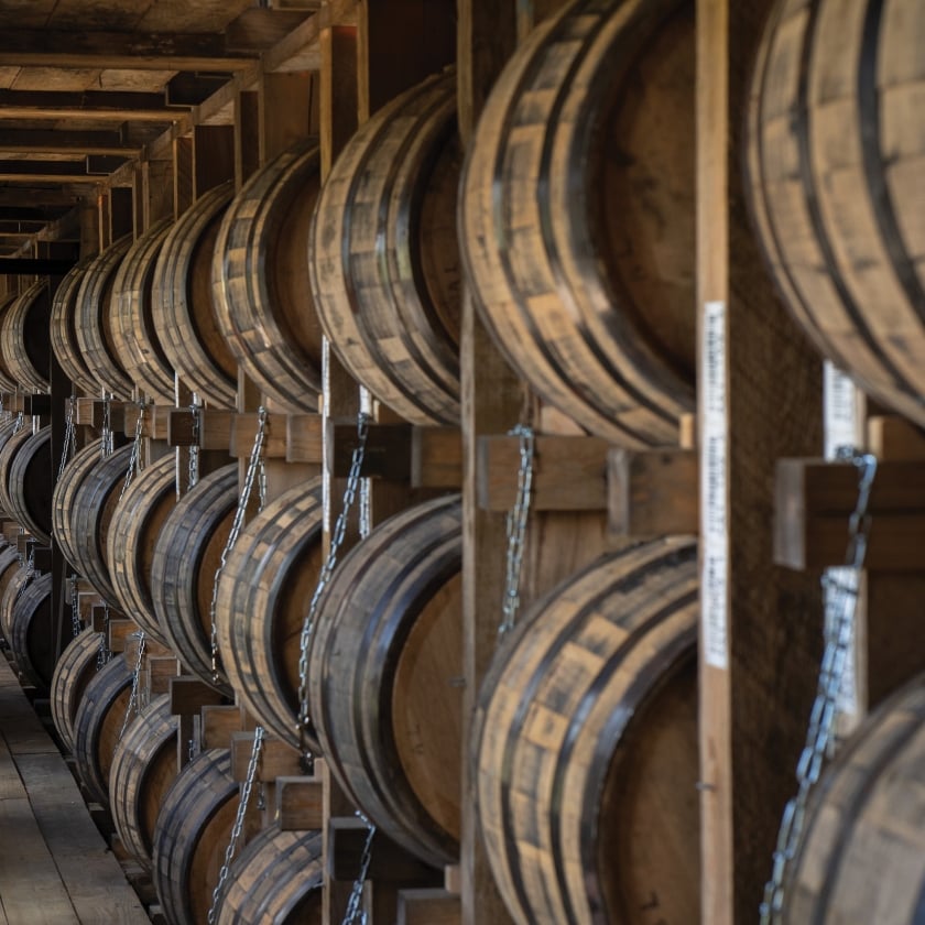 A row of barrels in a rickhouse
