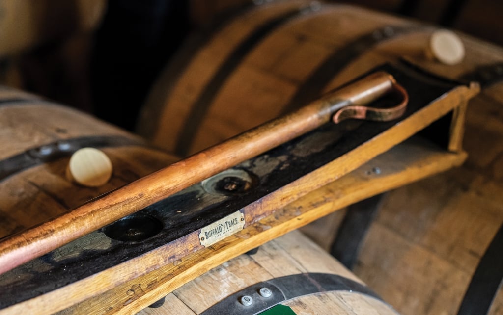 An up close picture of a barrel tasting portion of a Buffalo Trace Distillery tour intended for media kit usage.