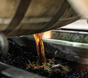 A closeup picture of barrel dumping at Buffalo Trace Distillery intended for media kit usage.