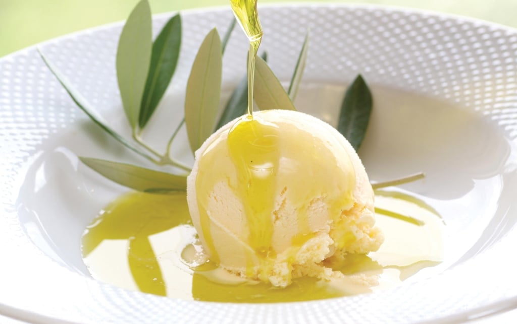 Over the lemon olive oil to vanilla ice on white plate