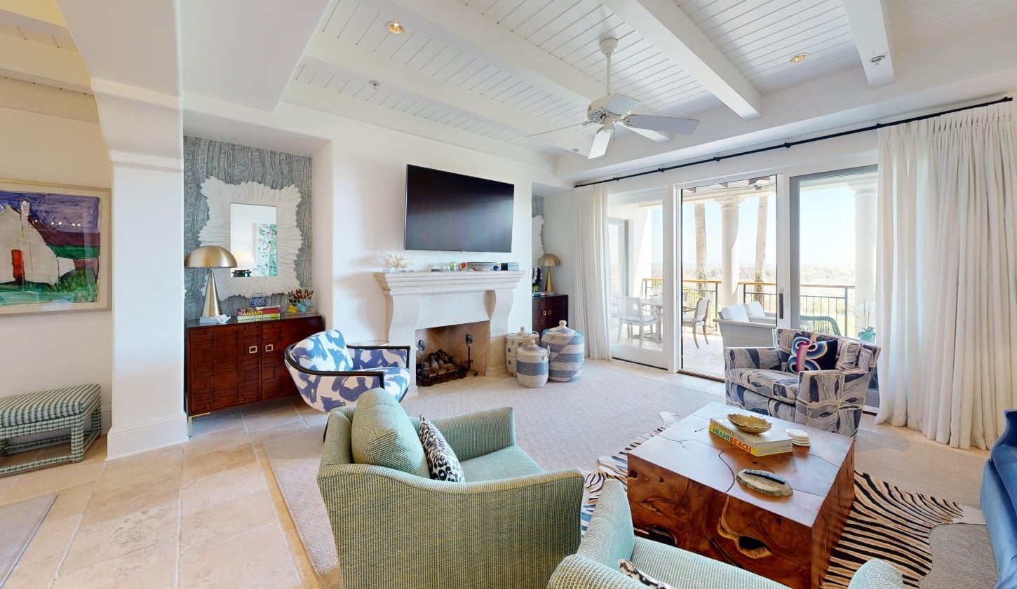 A living room with doors that open on to a patio