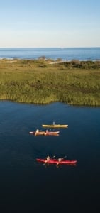 A family kayaking by Rainbow Island