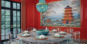A circular dining table in a red room